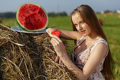 Grace lifts up her dress in a field from Fame Girls